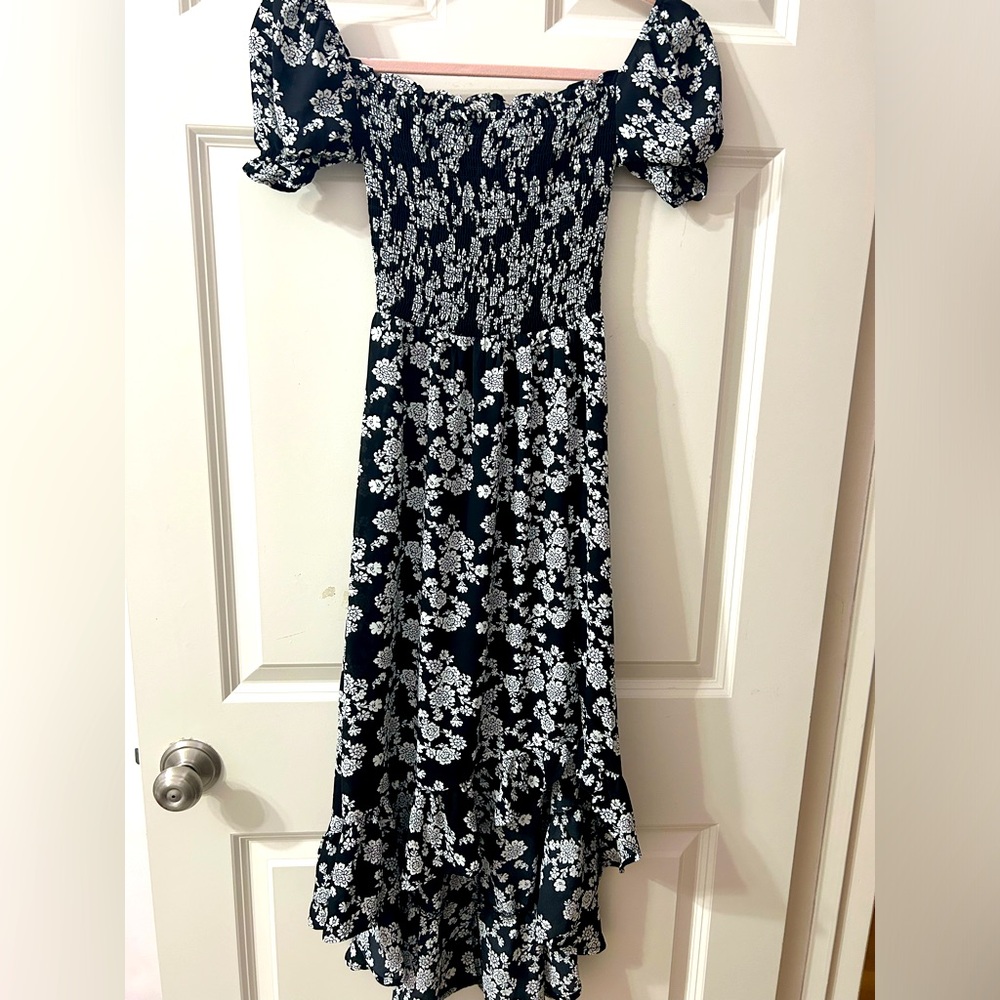 Cute Black floral dress perfect for girls going on vacation or events.
